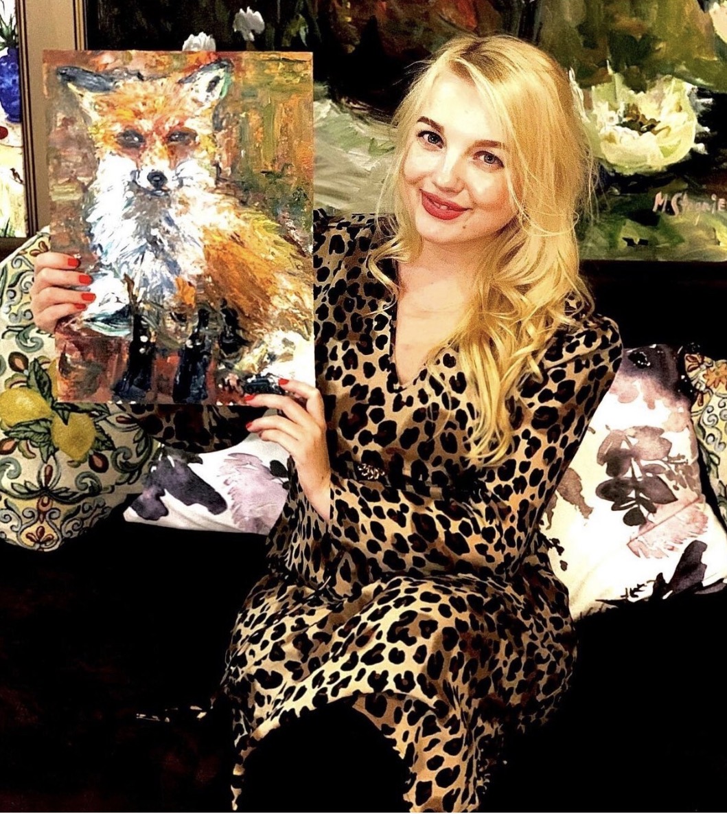 Marina Stognieva holding the completed painting Fox, Kyiv, 2021